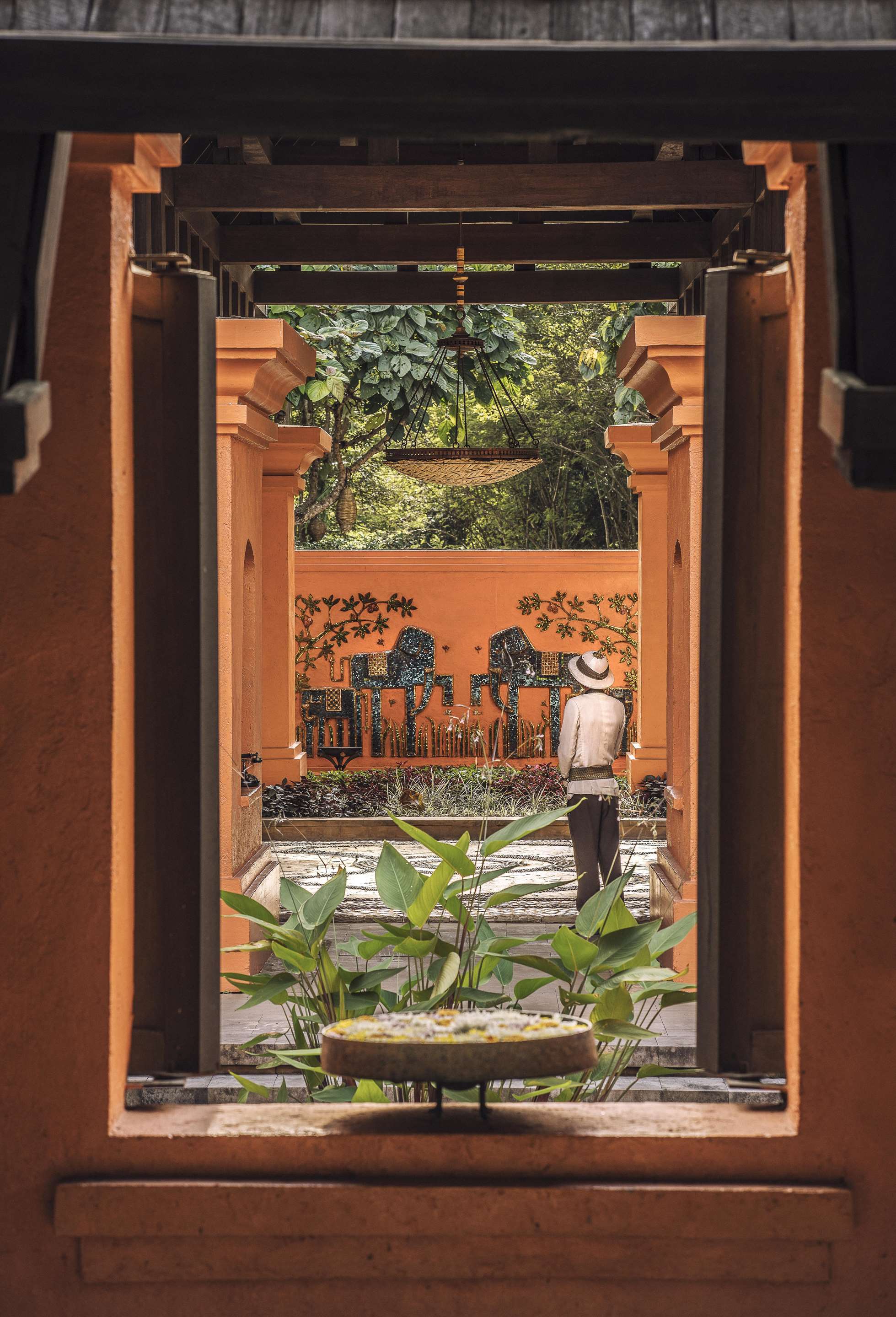 Entrance view of the lobby with team member standing to welcome guests