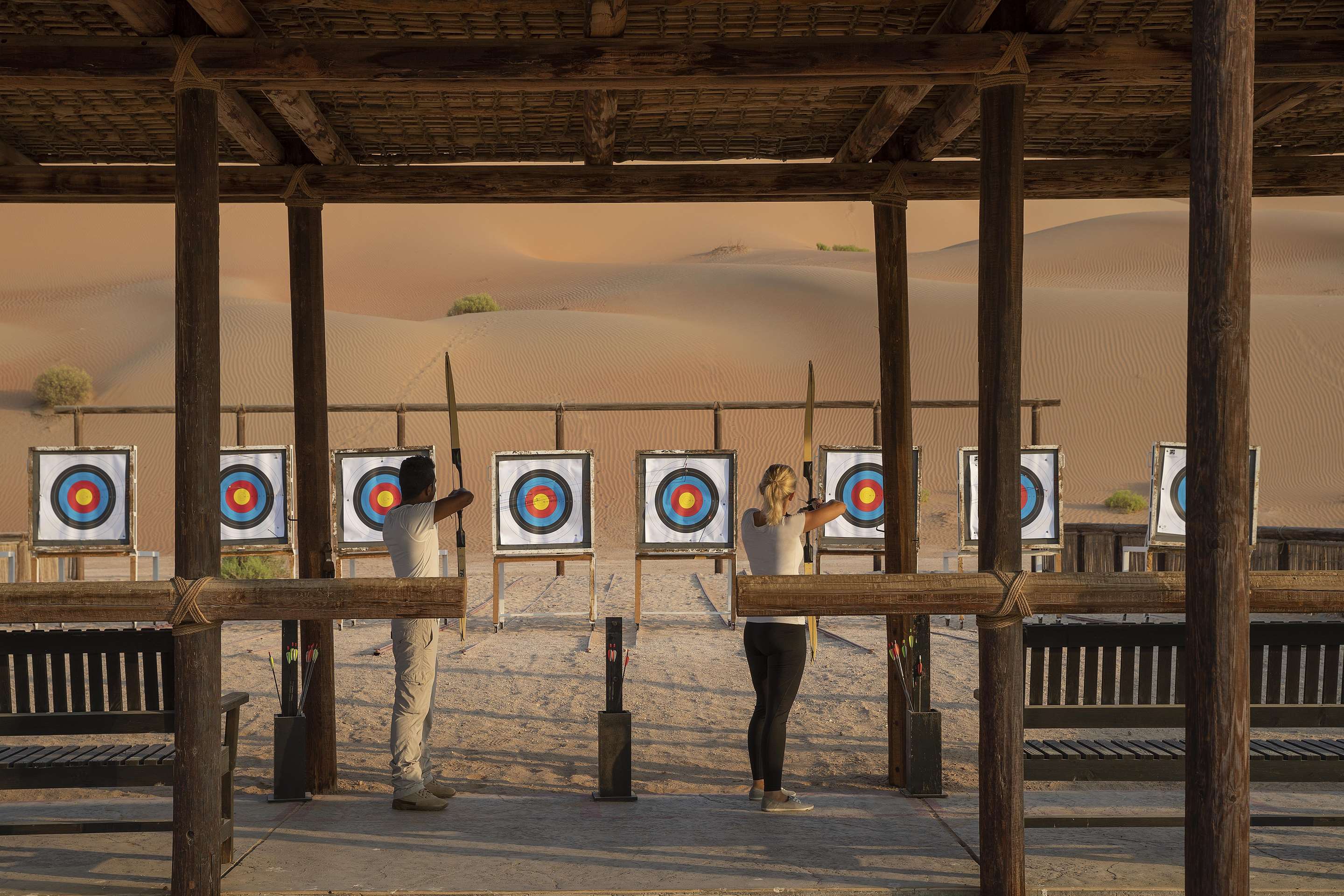 Exterior view of archery area in the desert with guests