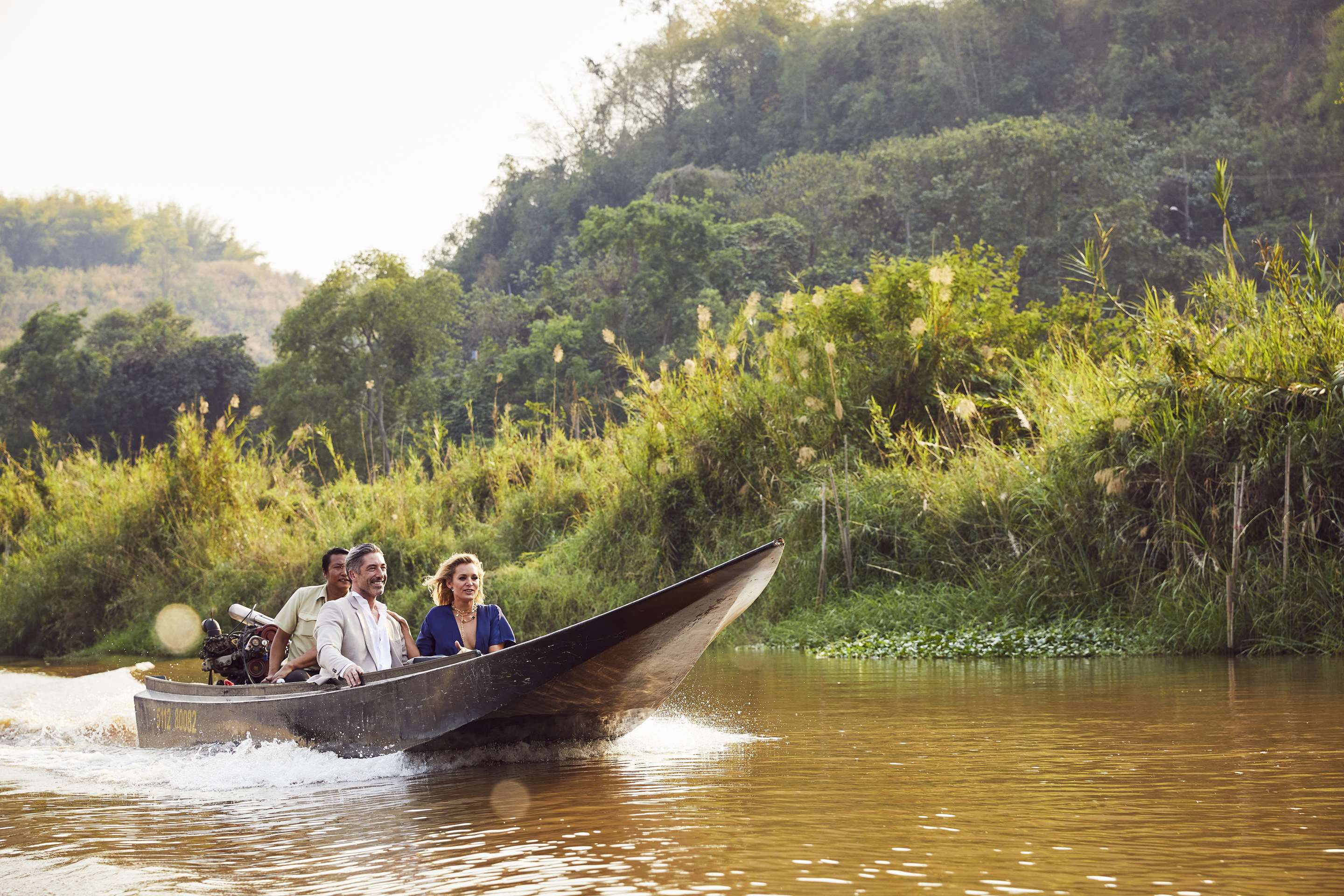 Couple on river boat ride as part of Dining By Design experience