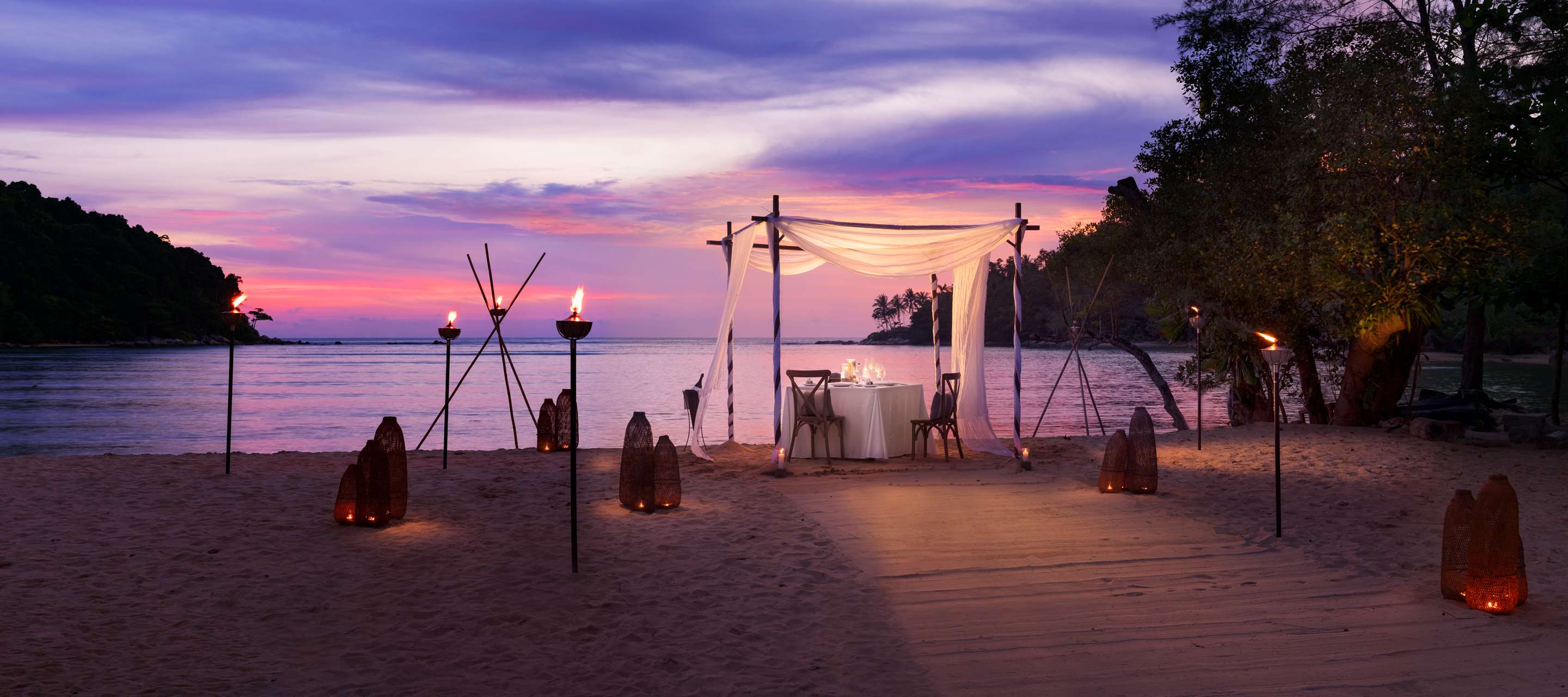 Dining by Design on the beach at sunset
