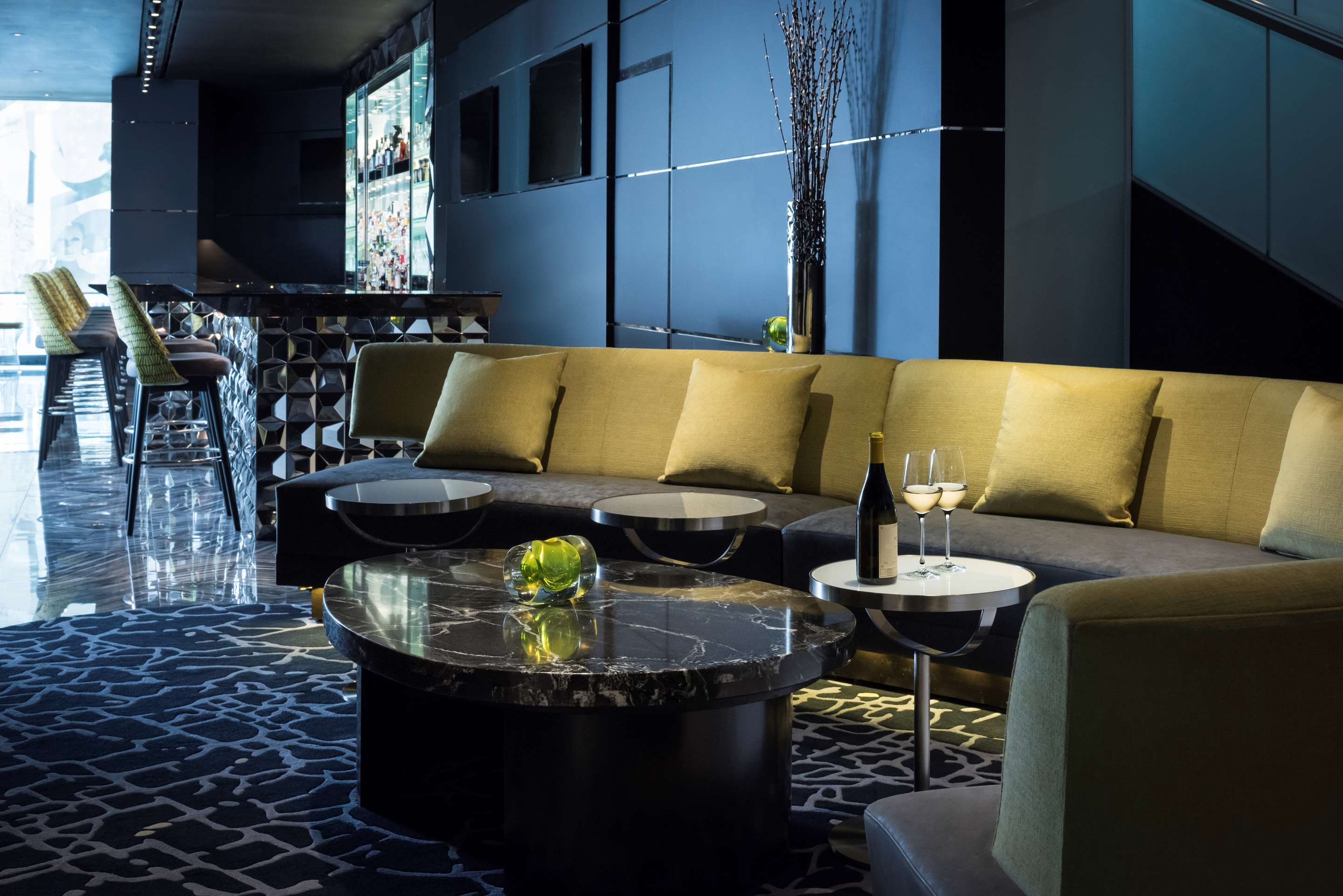 Le Bar seating across from fireplace