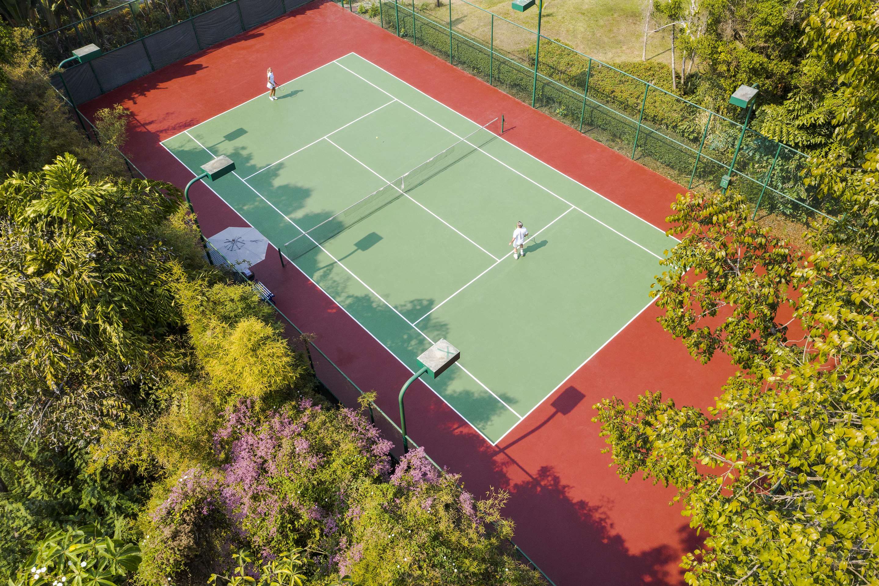Aerial view of couple playing tennis