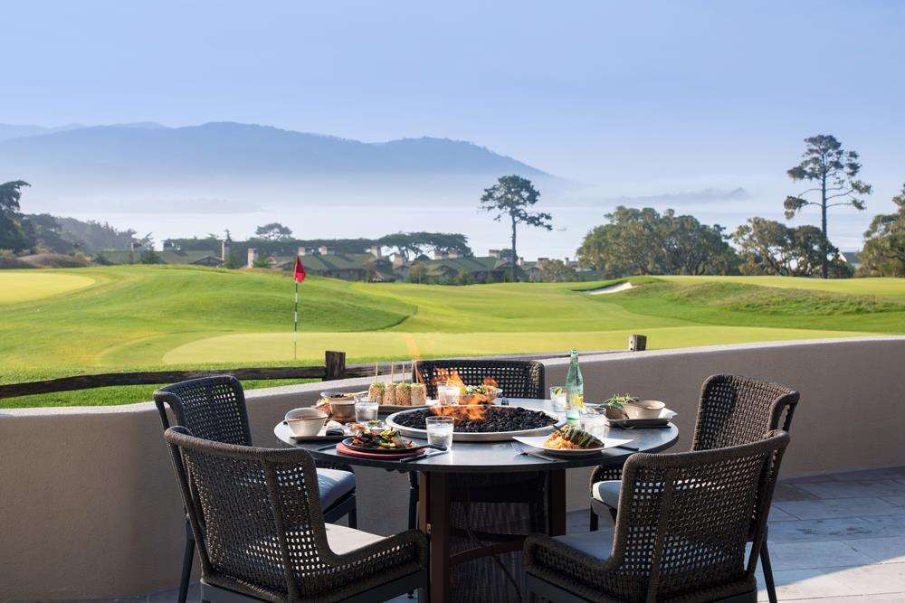 Pebble Beach Resorts - Hay's Place Restaurant Patio Table and 9th Hole (c) Pebble Beach Company