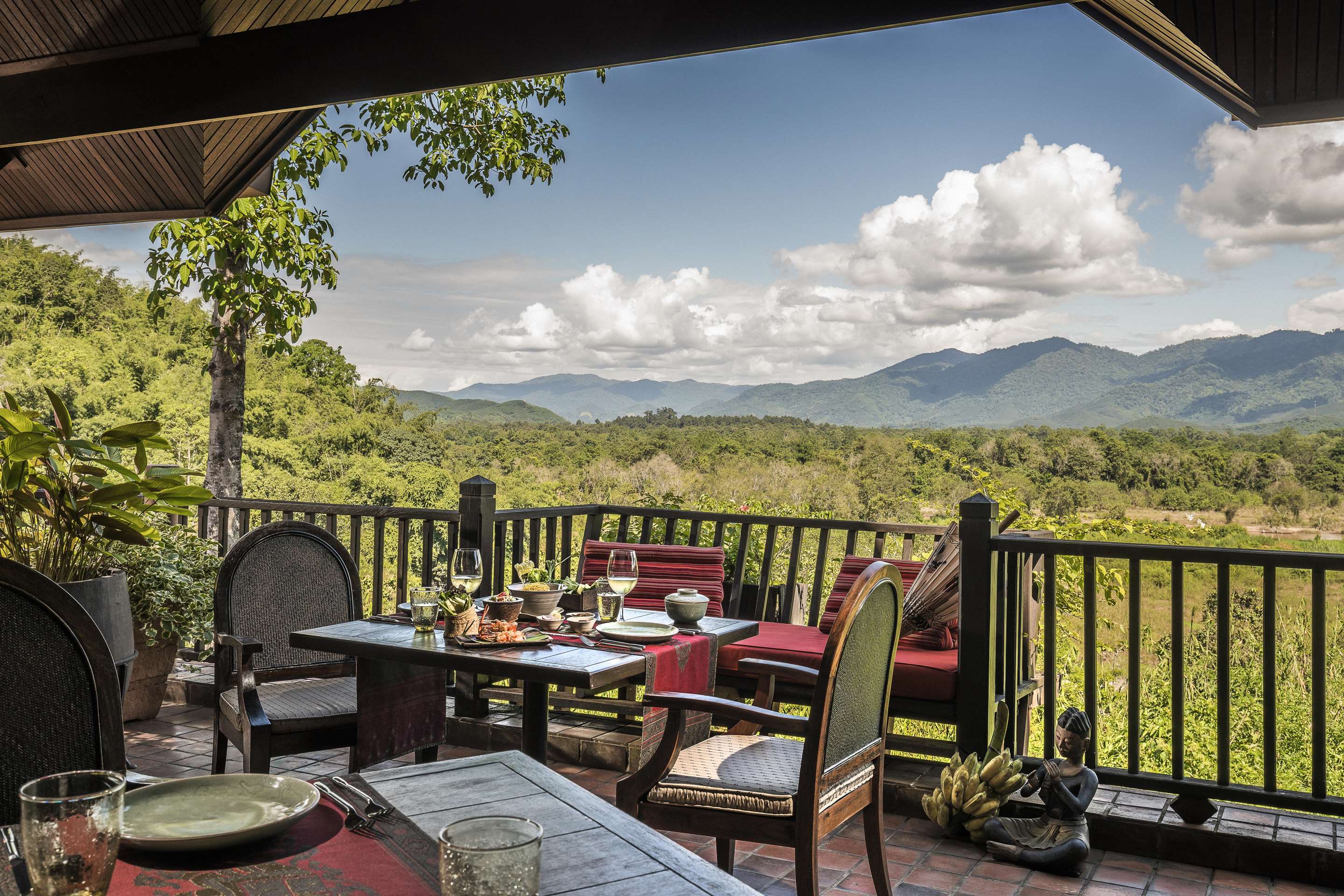 Table setup on the balcony of Sala Mae Naam Restaurant with country views