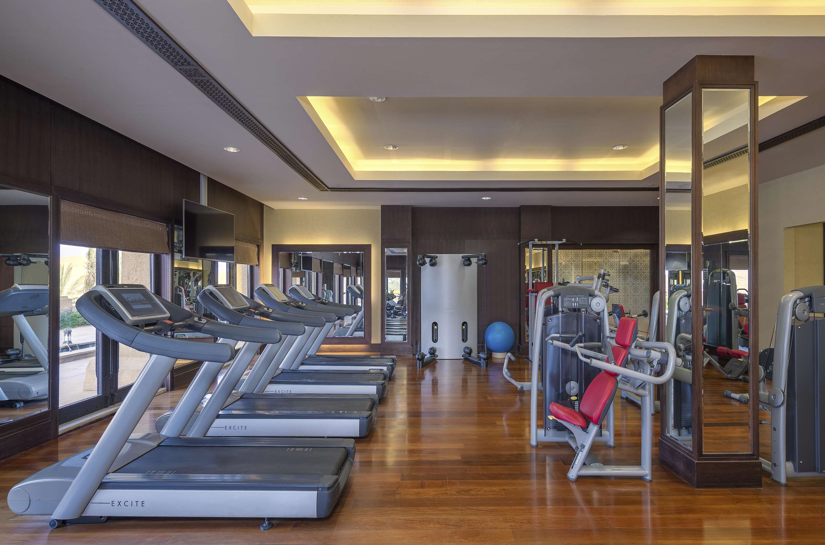 Interior view of resort gym with treadmills and other equipment