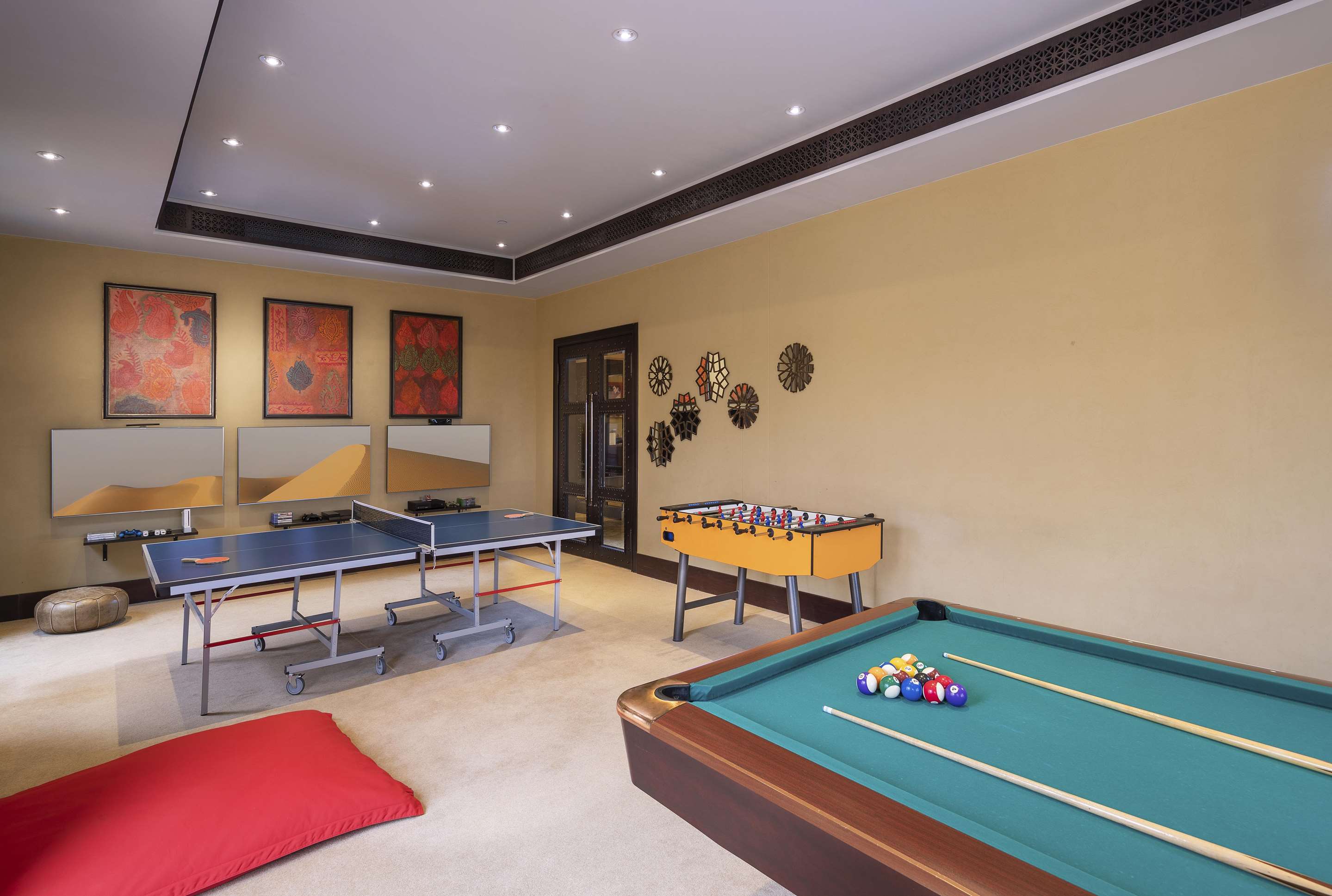 Interior view of Teens Club play room with pool table  ping pong table and video games